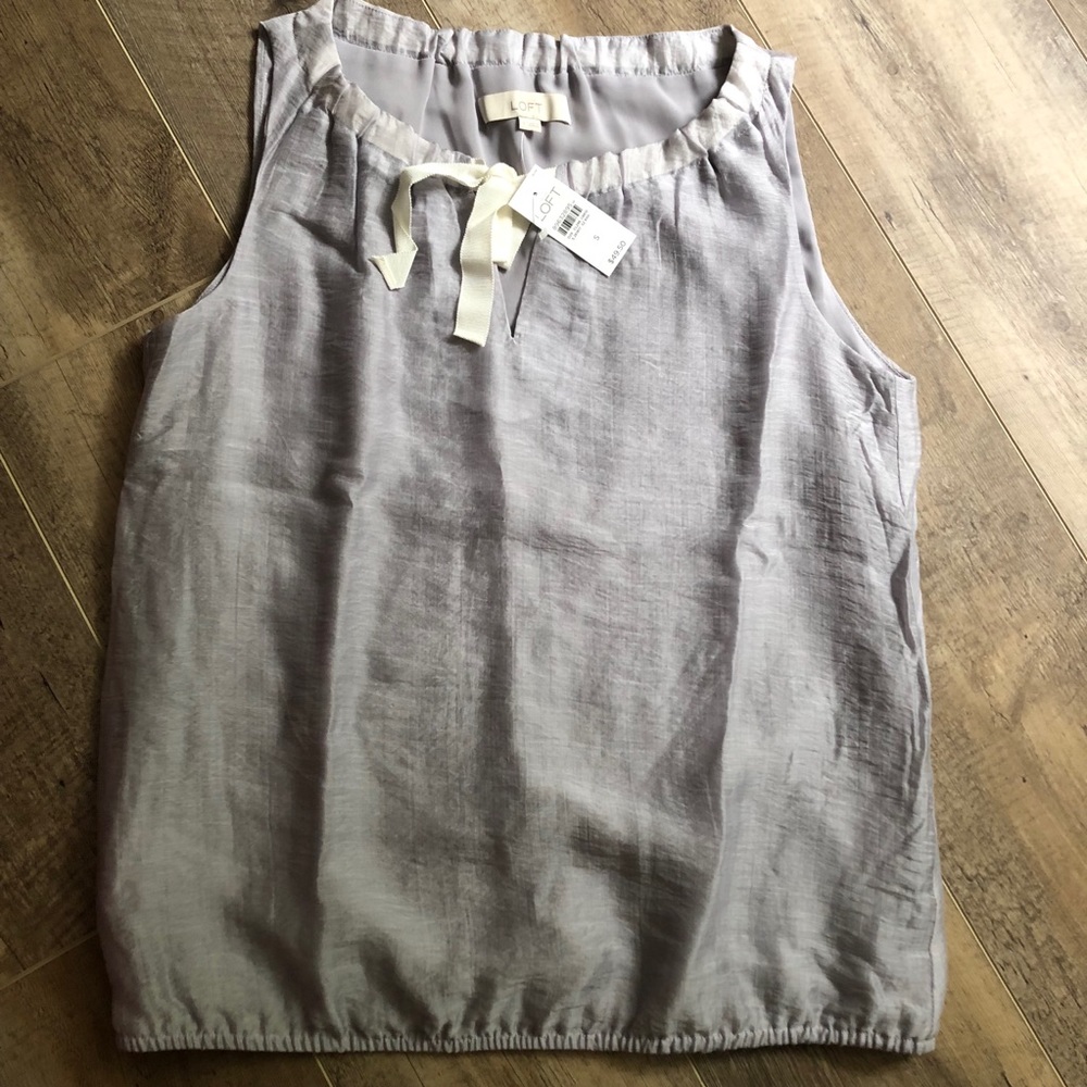 Grey sleeveless blouse